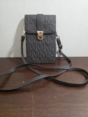 MKF Collection monogram vegan leather phone wallet crossbody bag.